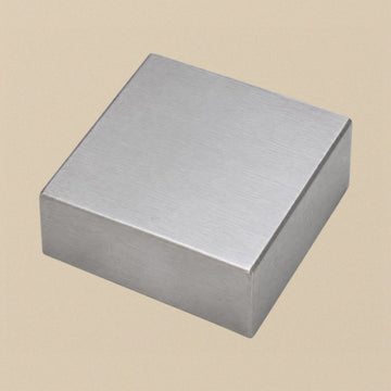 Solid steel doming bench block, angled view of the plain square block with a brushed finish