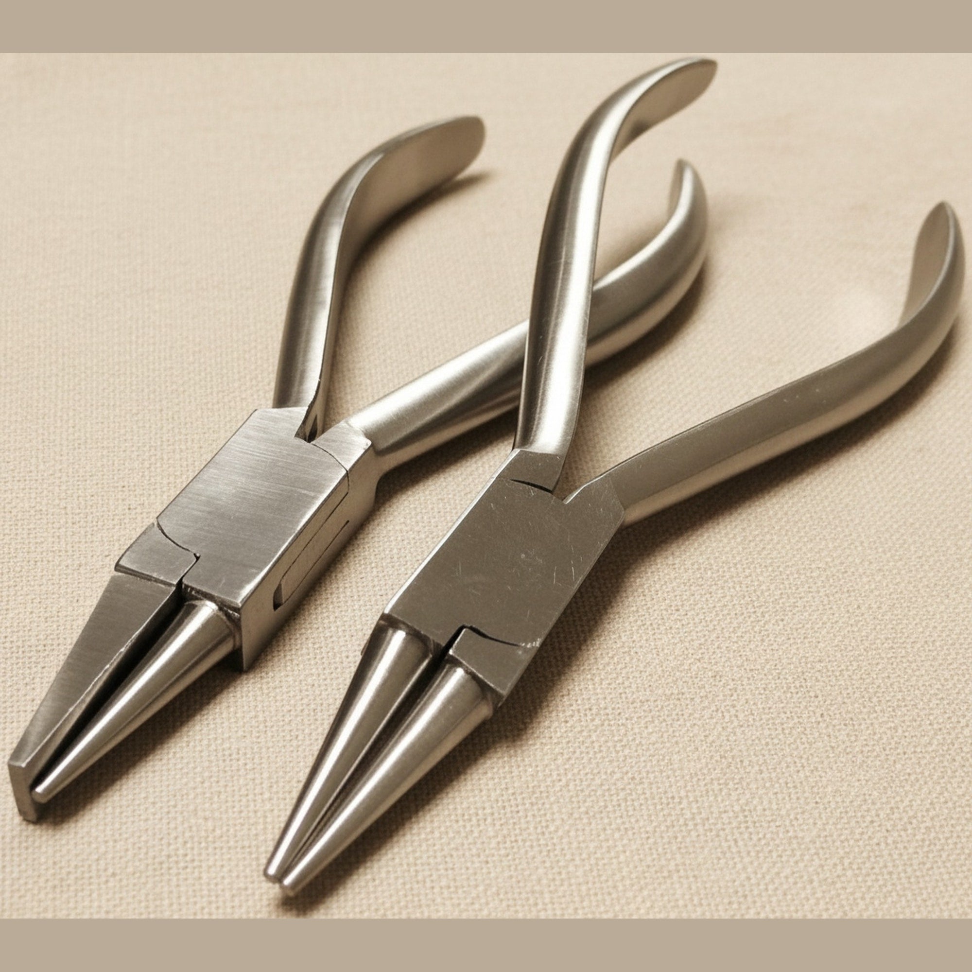 A two-piece set of stainless steel orthodontic pliers, one with round nose jaws and one with combination round/flat nose jaws, shown against a white background.