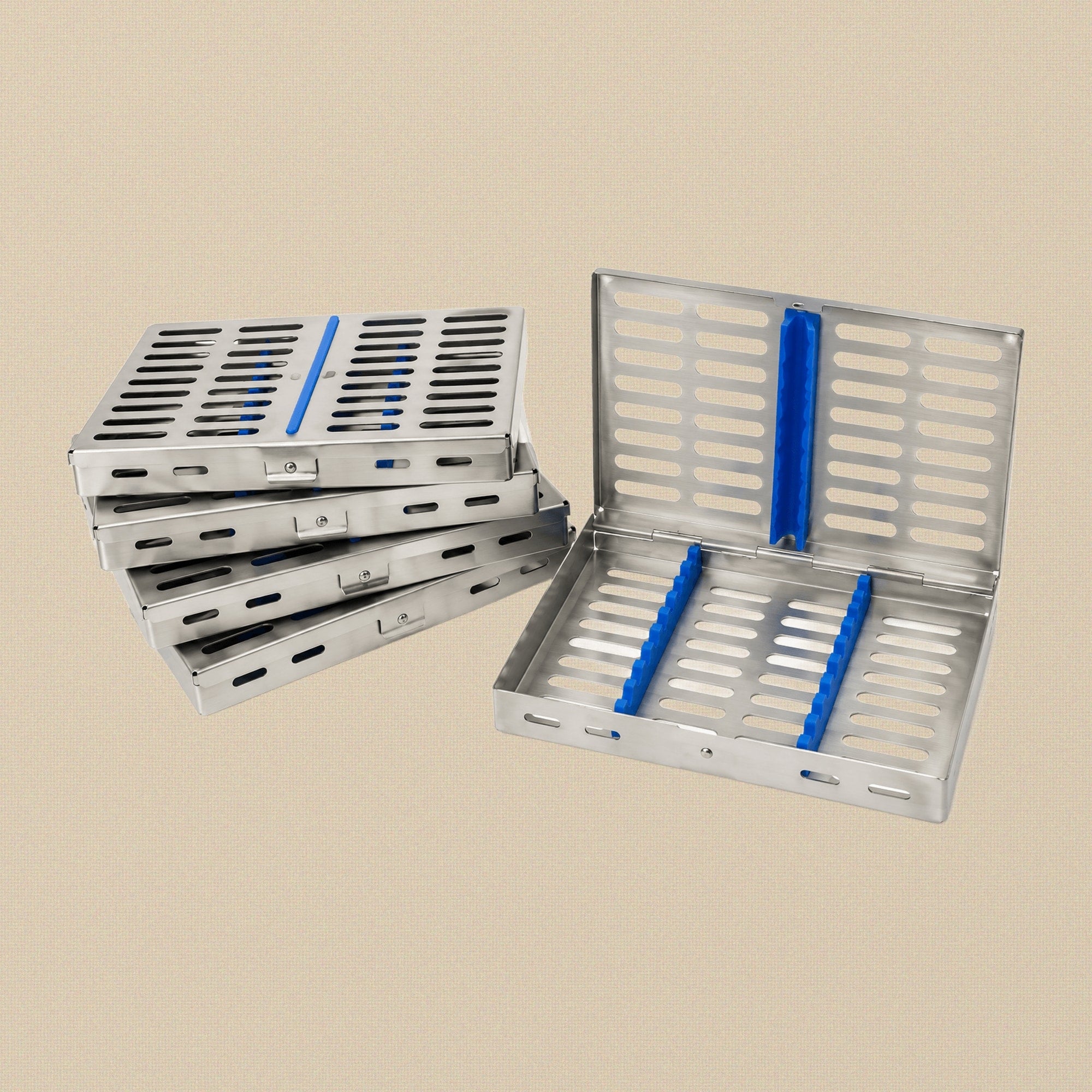 Set of five stainless steel sterilisation cassette trays, each open to show the internal silicone instrument racks.