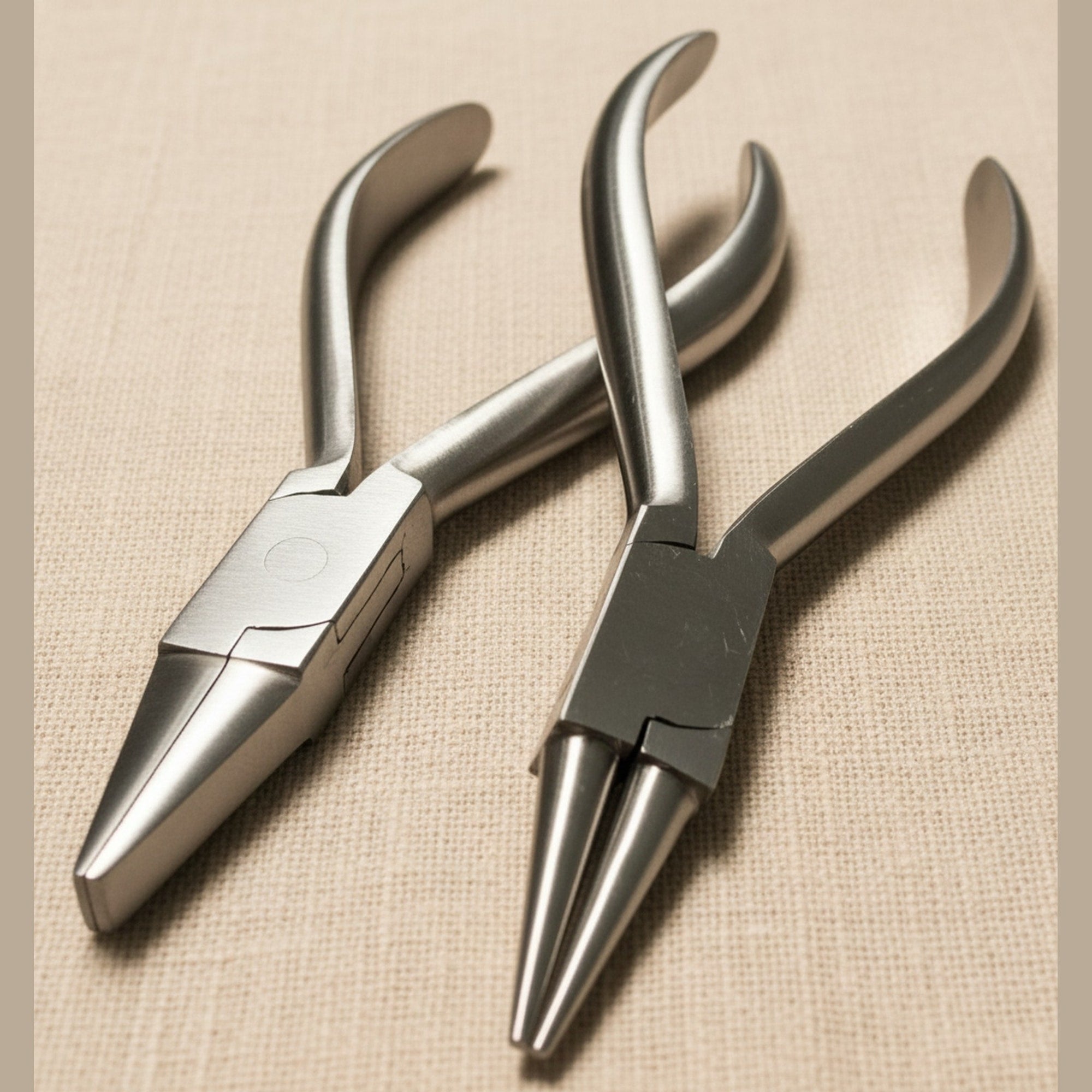 Set of two stainless steel orthodontic pliers, one round-nose and one flat-nose, on a white background.
