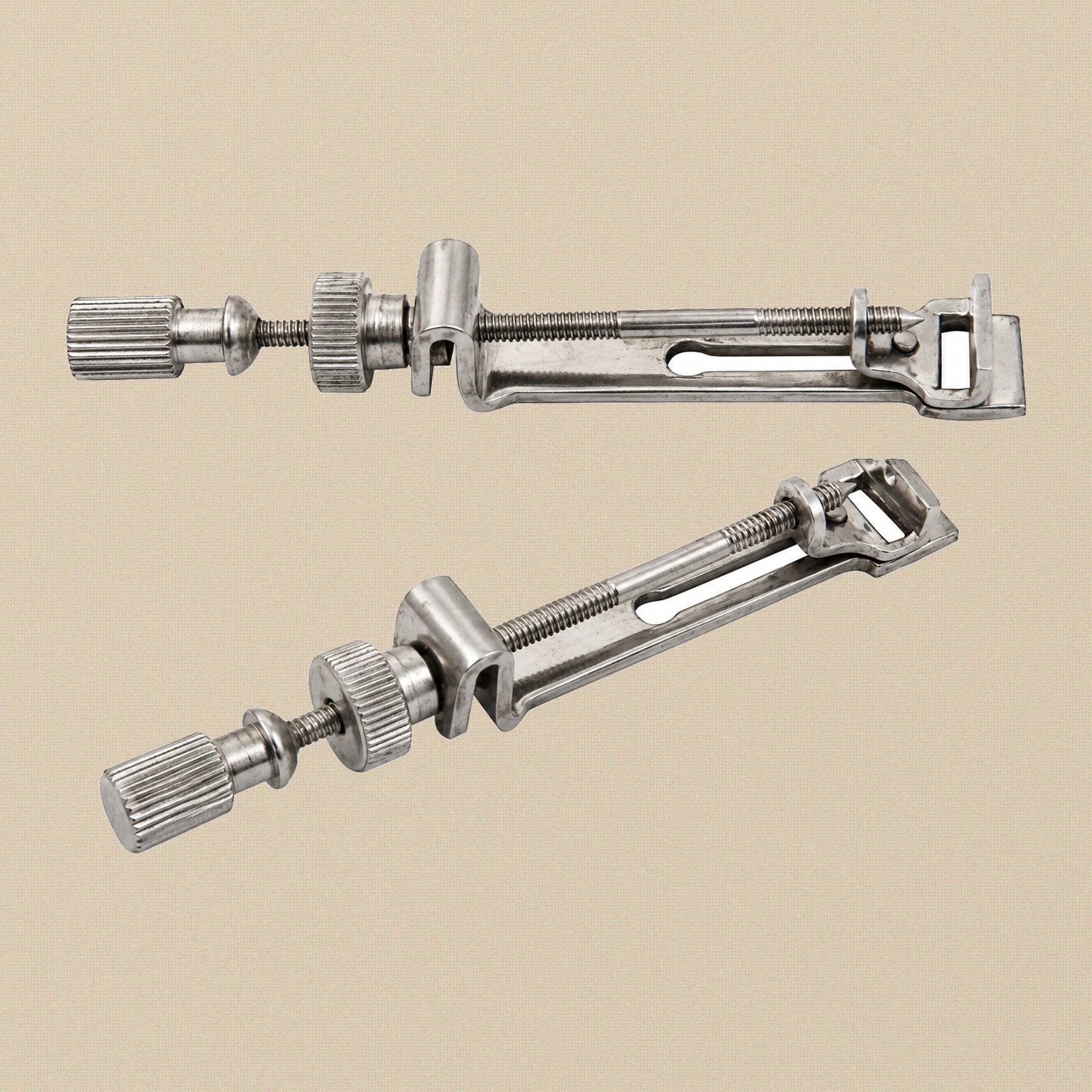Universal Tofflemire matrix retainer in stainless steel, shown from the side.