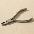 A pair of 14 cm stainless steel flat nose utility pliers with a box joint, shown on a white background.