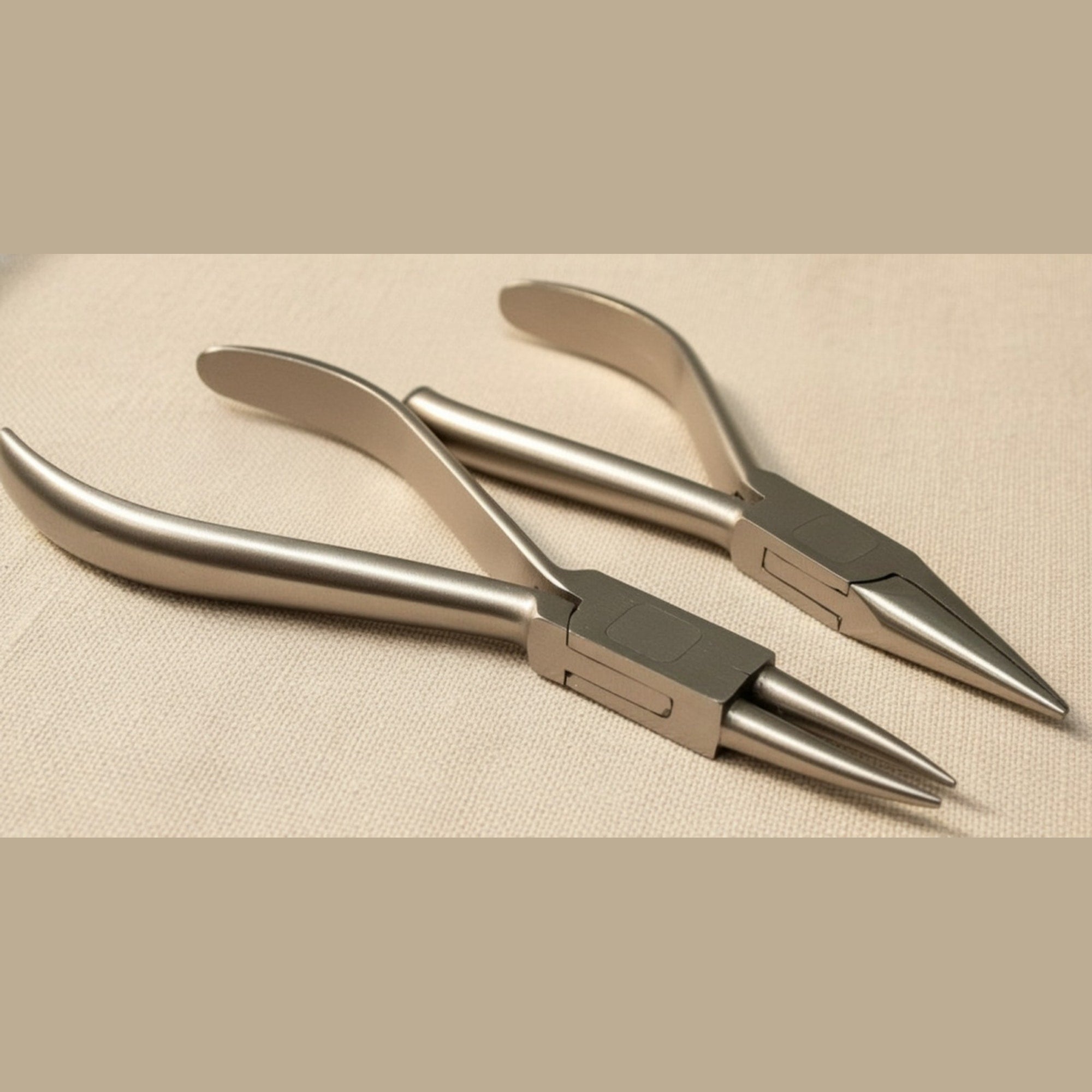 Set of two stainless steel orthodontic pliers, one round nose and one chain nose, shown side-by-side on a white background.