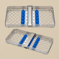 Stainless steel autoclave sterilisation cassette for five dental instruments, shown closed.