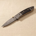 Damascus Steel Folding Knife with Black Ram Horn Handle & Leather Sheath, 7.5-inch | Folding Knife | Toolsmith Ltd UK