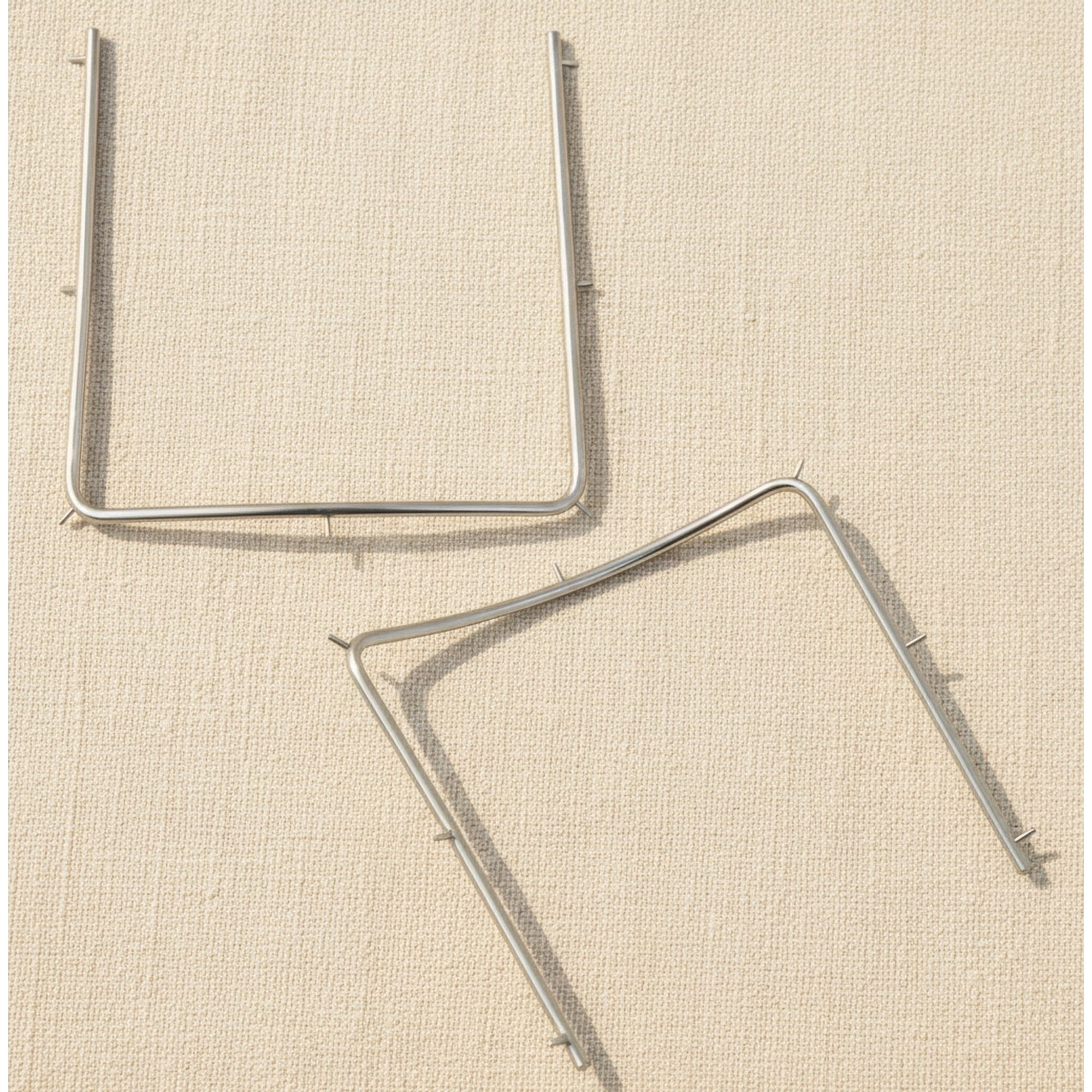 Autoclavable stainless steel rubber dam frame shown from the front.