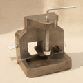 Side view of the cast iron bench anvil, showing the clamp screw mechanism.