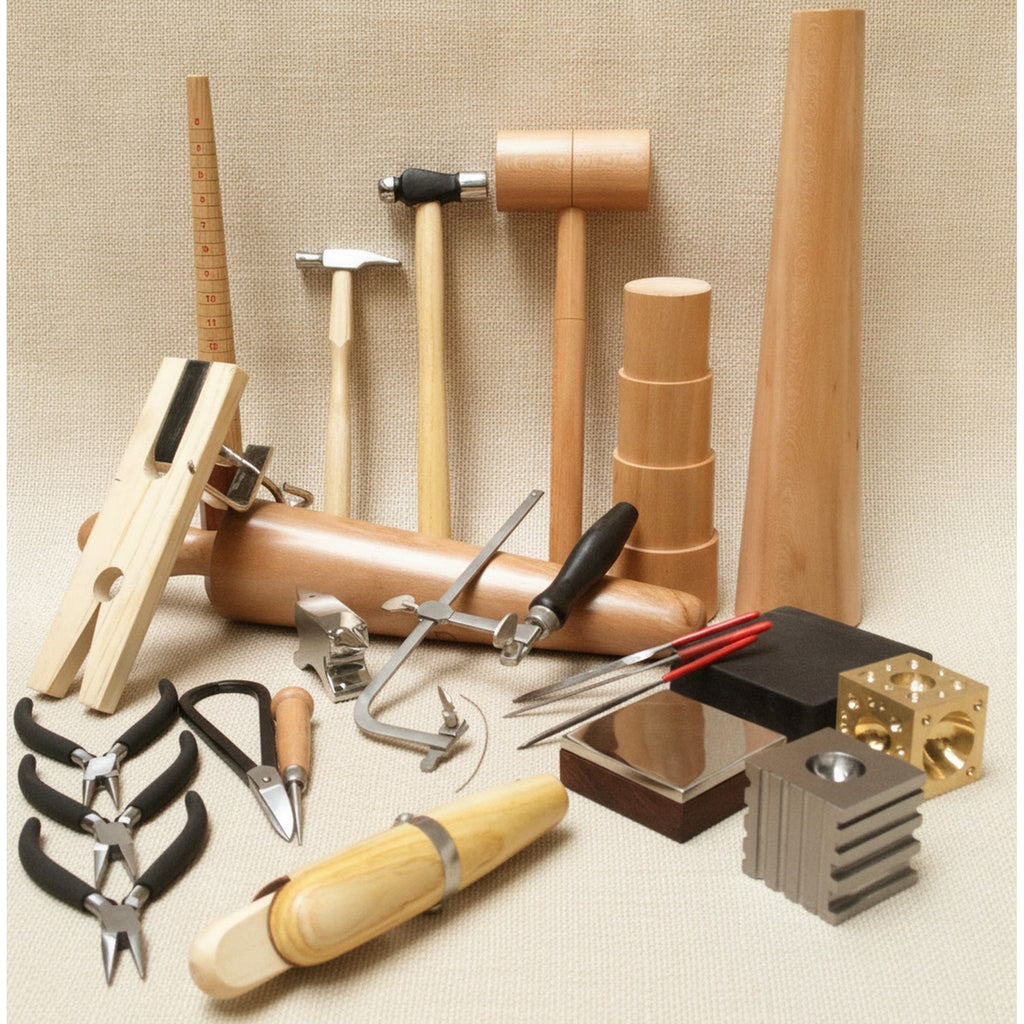 Close-up of the steel dapping block and punches included in the jewellery starter kit.