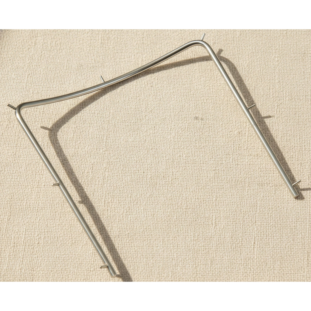 Close-up of the polished stainless steel finish on the rubber dam frame.