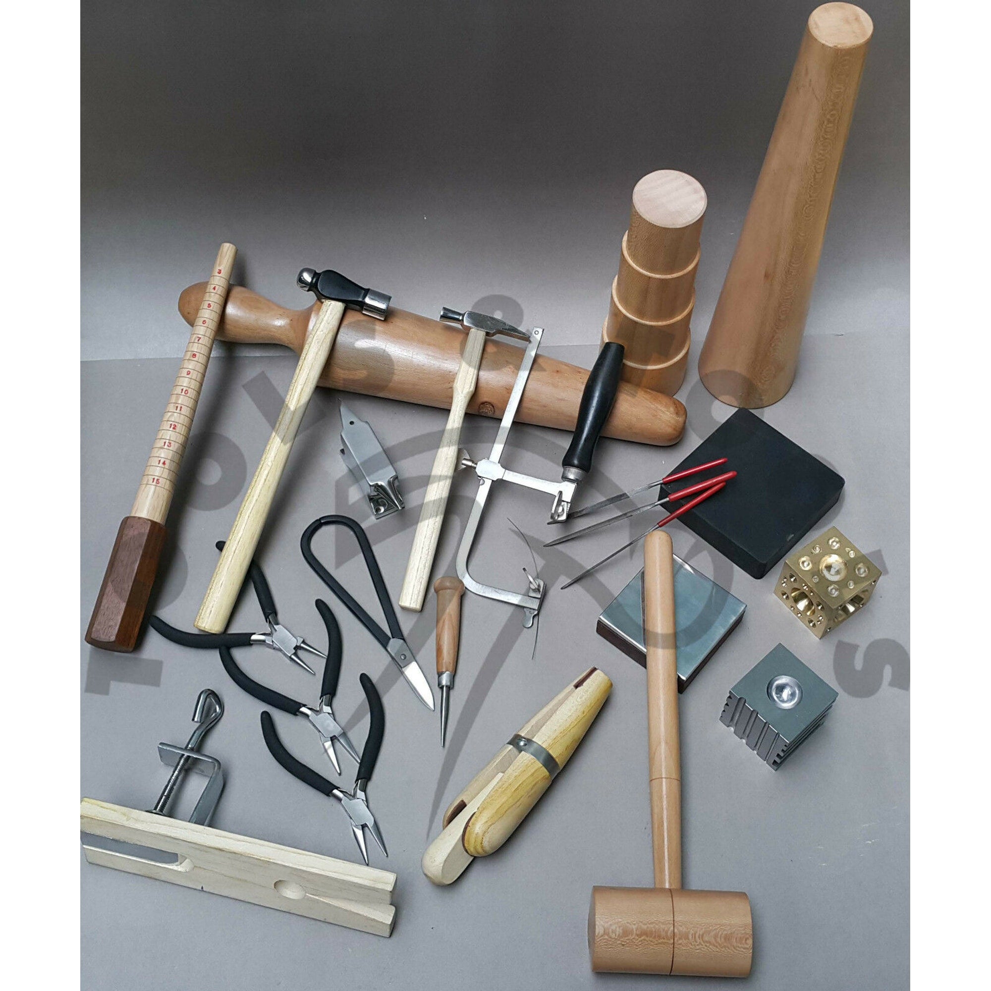 Detail view of the jeweller's saw frame, bench pin with clamp, and needle files.