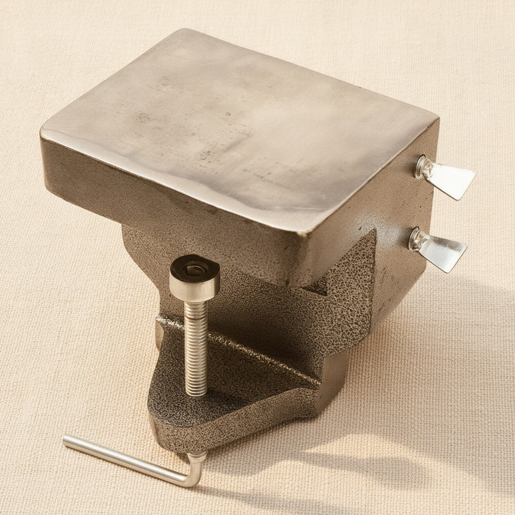 The bench anvil holding a steel ring mandrel to illustrate its support capability.