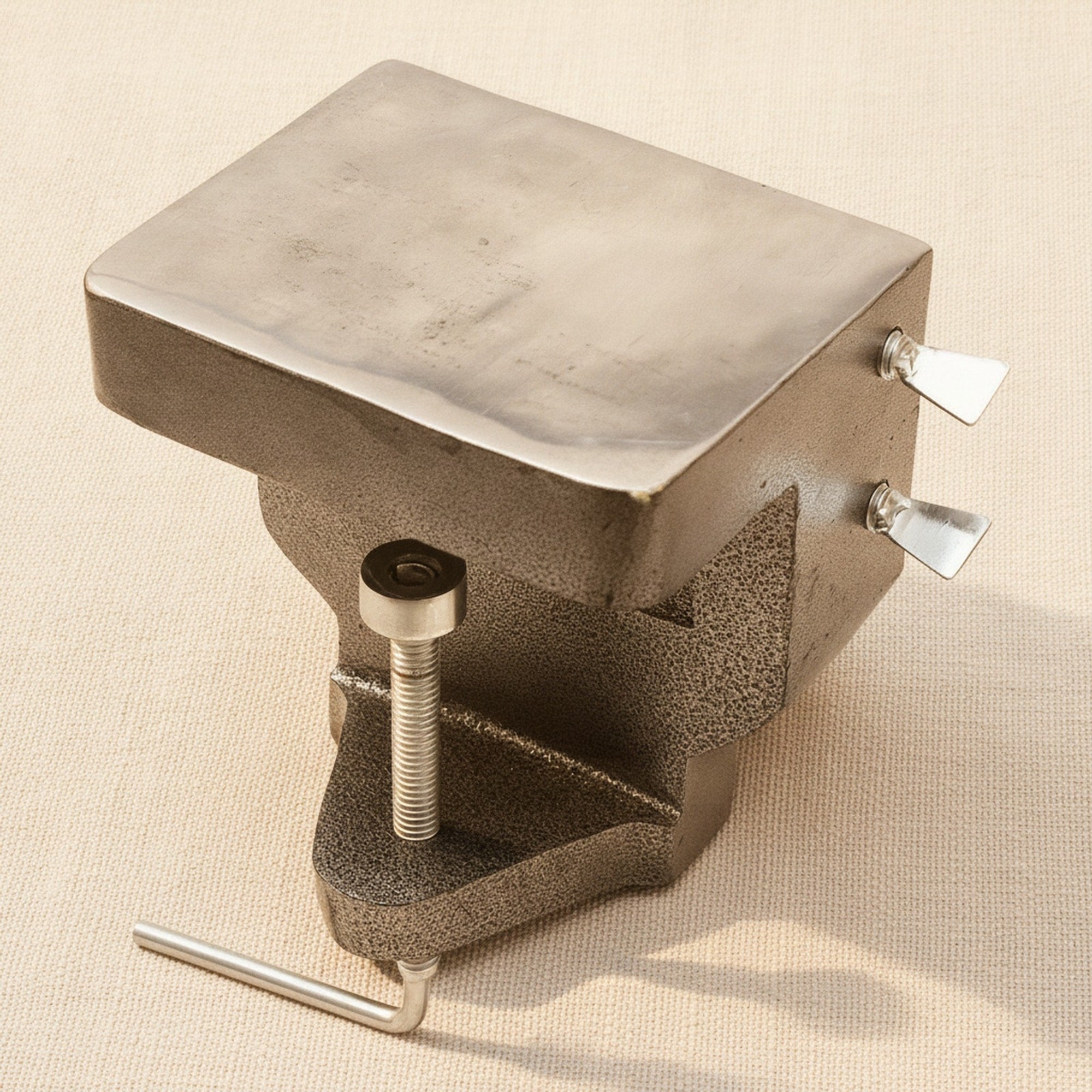 The bench anvil holding a steel ring mandrel to illustrate its support capability.