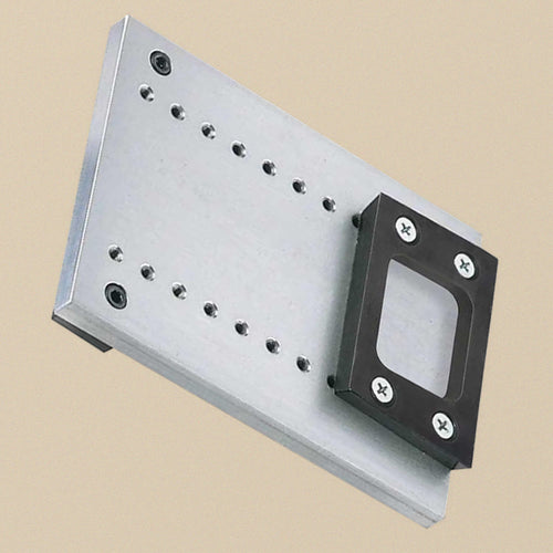 Adjustable height bracket kit at an angle, the plate lying flat with two rows of bolt holes and the bracket at one end