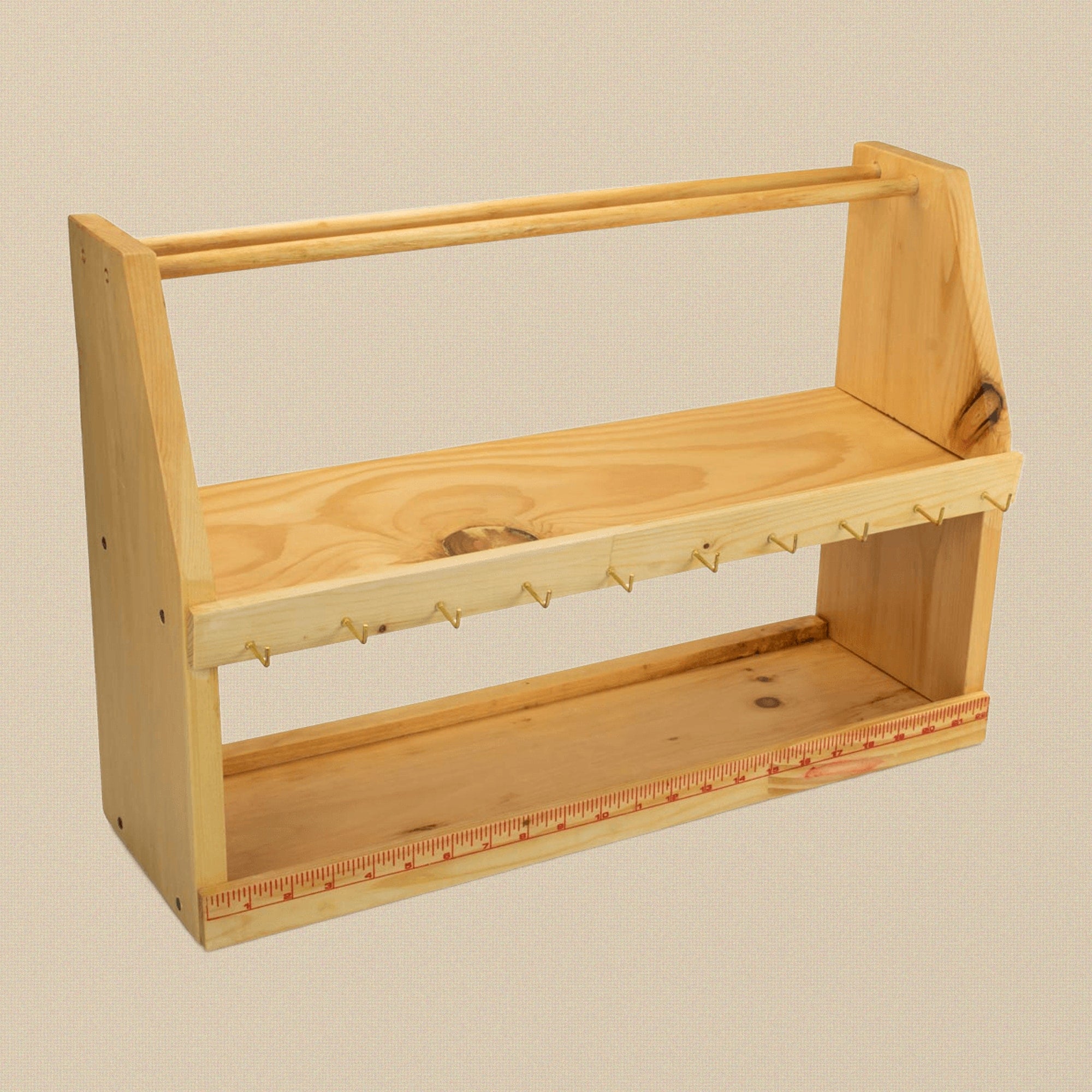 Wooden workbench tool station in white pine with a hook rail and two shelves