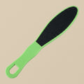 A double-sided pedicure foot rasp with a green plastic handle and two abrasive surfaces, shown on a white background.