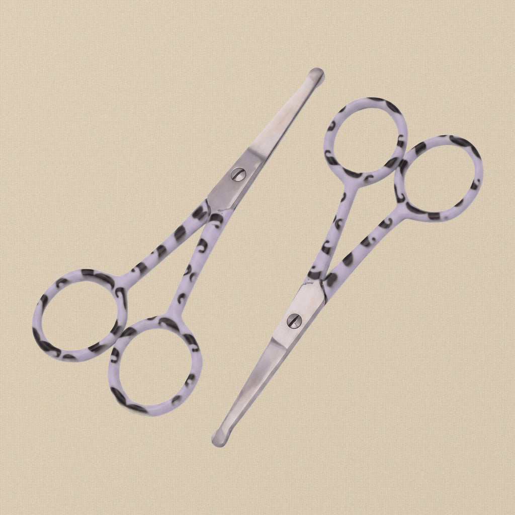 A pair of 4-inch stainless steel bull-nose grooming scissors with patterned handles, shown closed against a white background.