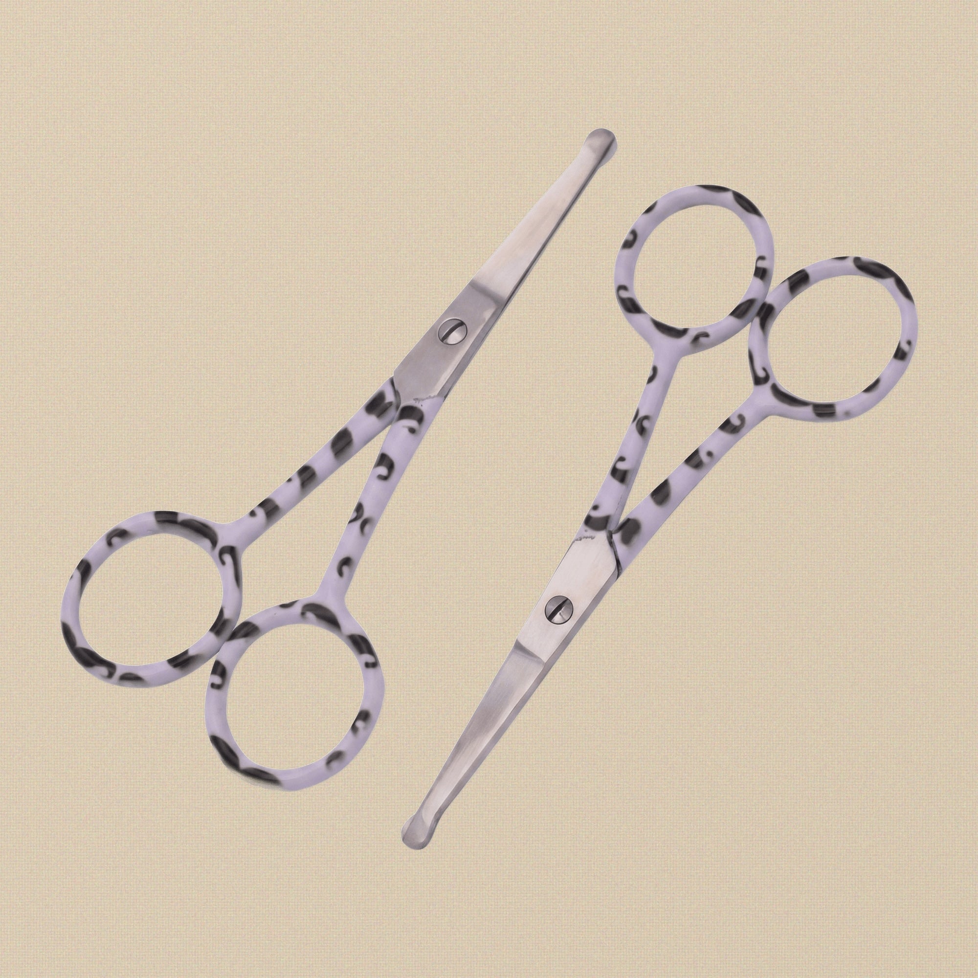 A pair of 4-inch stainless steel bull-nose grooming scissors with patterned handles, shown closed against a white background.
