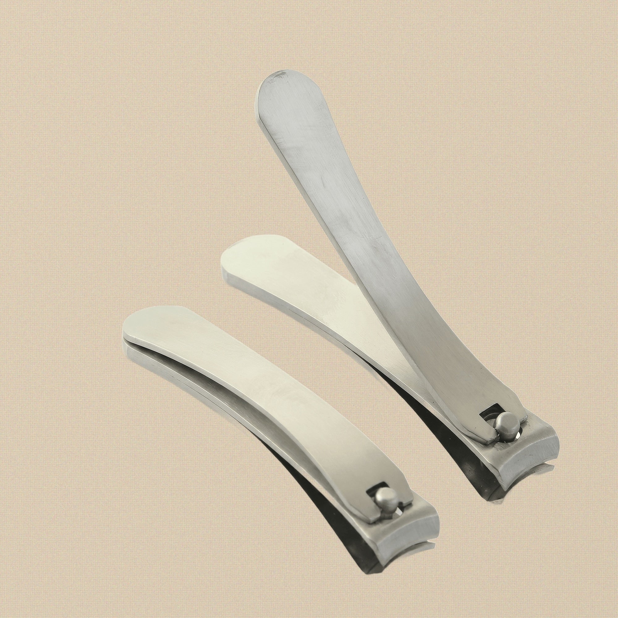 Professional German steel nail clippers in two sizes, small and large, on a white background.