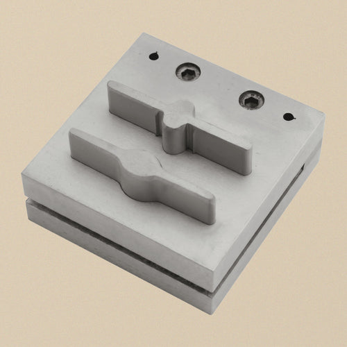 Bar and paddle disc cutter set at an angle, both punches sitting in the die block