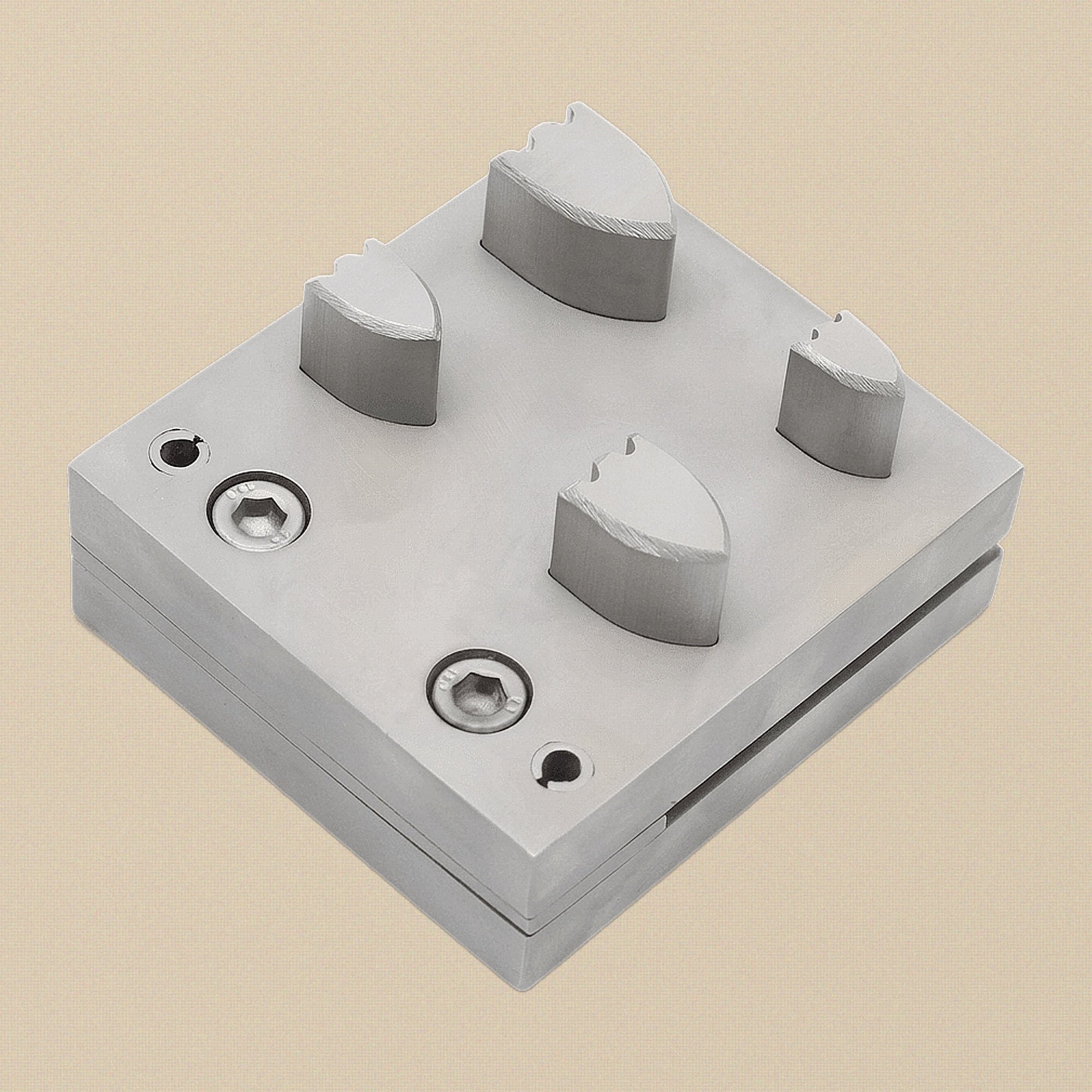 The four hardened steel punches arranged by size, showing cutting and striking ends.