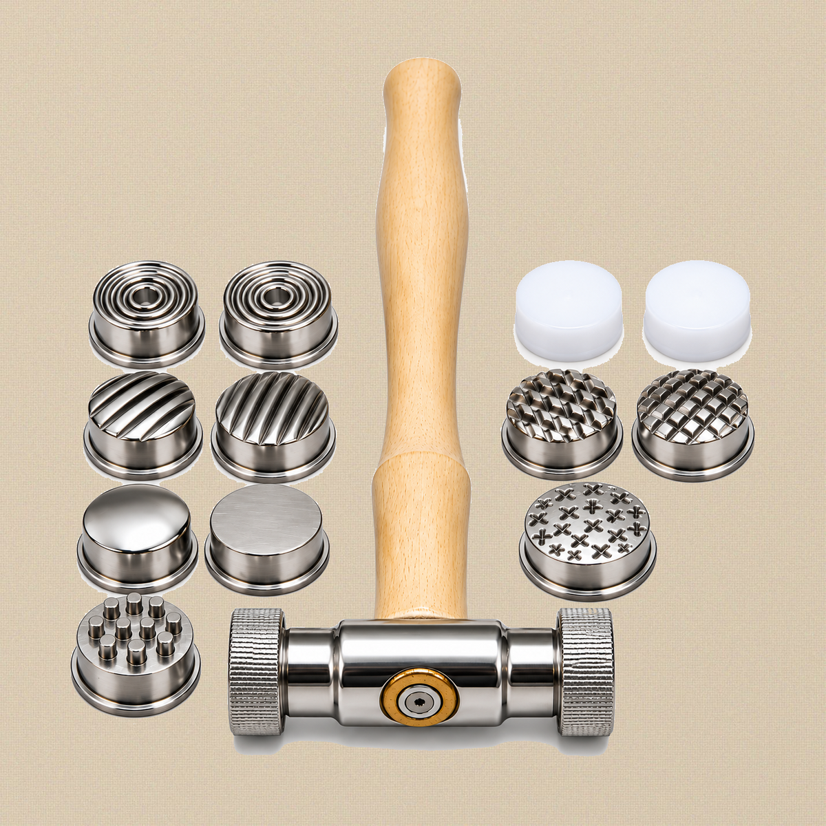 Texturing hammer with wooden handle and knurled steel head, with its 12 interchangeable faces: patterned and plain steel faces and two white nylon faces