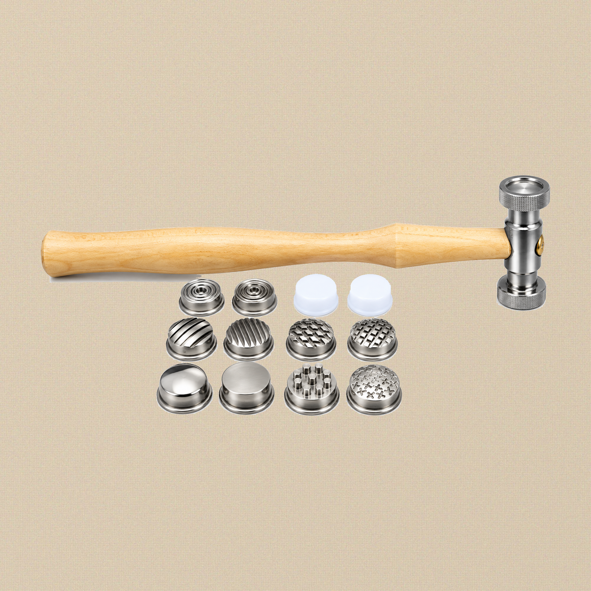 Texturing hammer lying above its 12 interchangeable faces in three rows, including two white nylon faces
