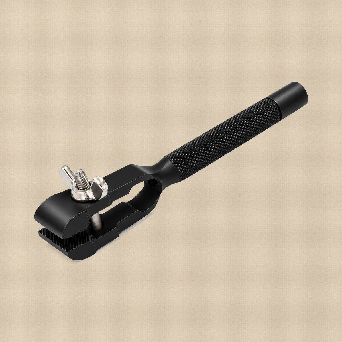 Black anodised hand vice with wide jaws and a hollow handle