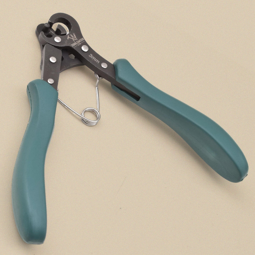 One step looper pliers with black head marked '3mm', teal grips and a coil spring, jaws open at top left