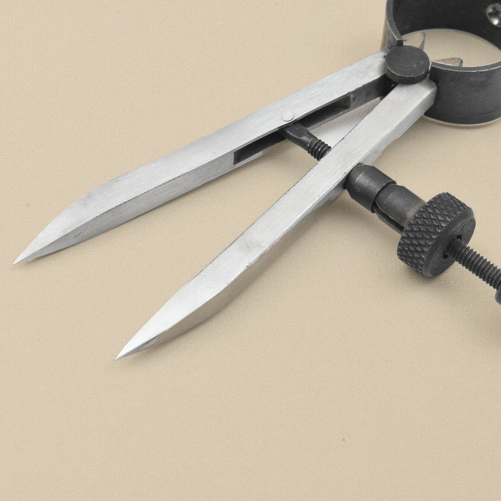 Close-up of the pointed divider legs