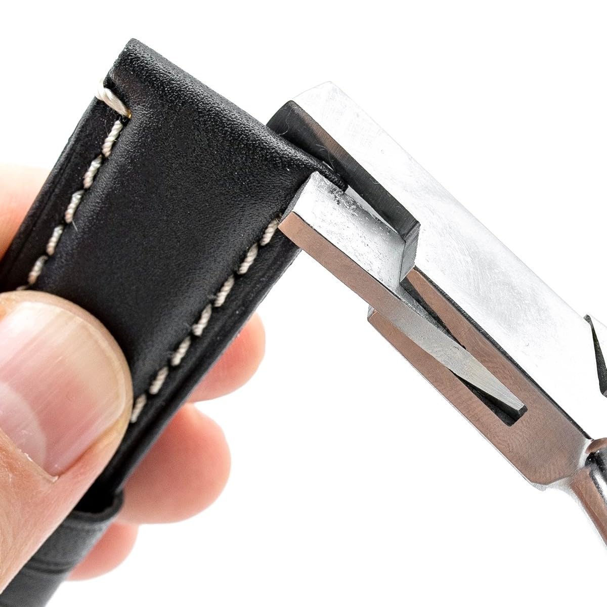Notching a black leather watch strap with the 3mm notching pliers