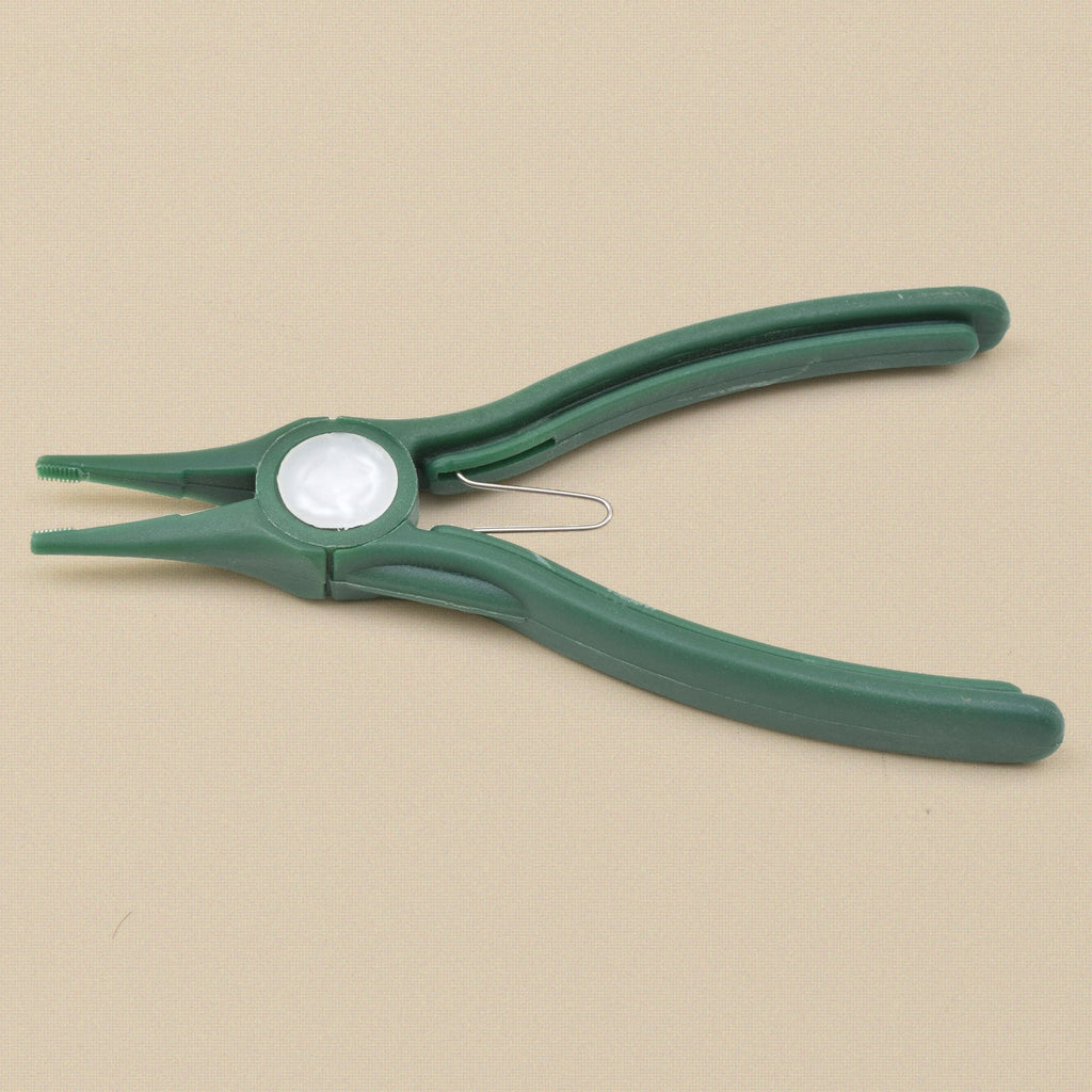 Green plastic chain nose pliers from the side, showing the nylon jaw