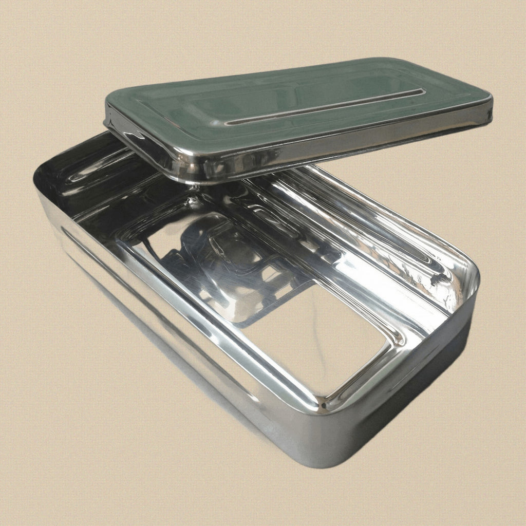 Stainless steel instrument sterilisation box with lid, shown closed. Dimensions 20x10x4 cm.