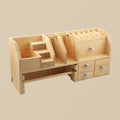 Wooden bench top organiser for jewellery tools, showing four drawers and top-tier tool slots.
