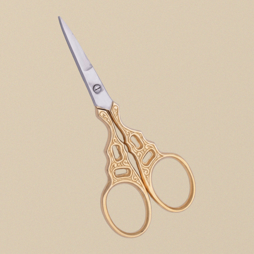 Detail shot of the fine, sharp points on the 89 mm gold-plated craft scissors.