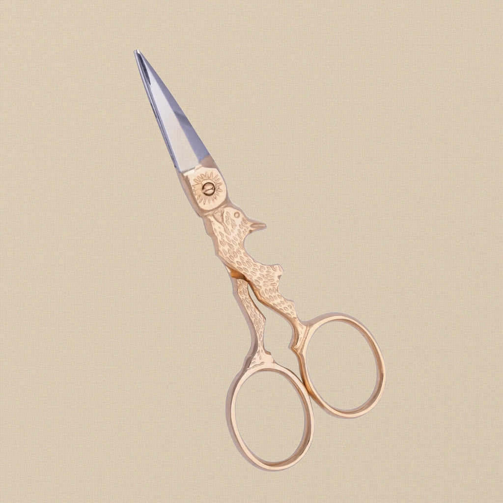 Close-up of the sharp blades and gold-plated finish on the 4-inch rabbit scissors.