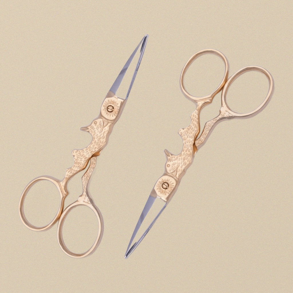Detail view of the rabbit-shaped handles of the craft scissors.