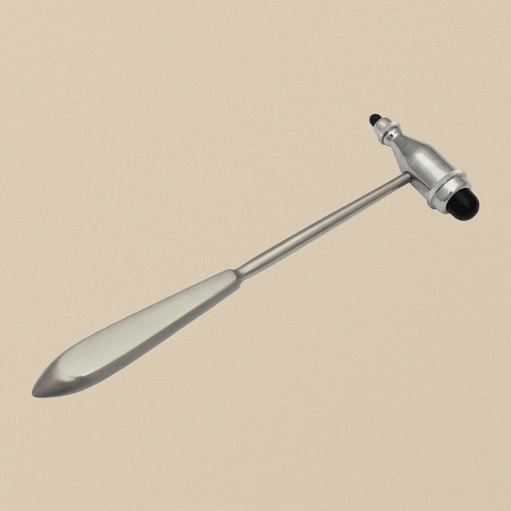 Close-up of the large and small synthetic rubber heads on the reflex hammer.