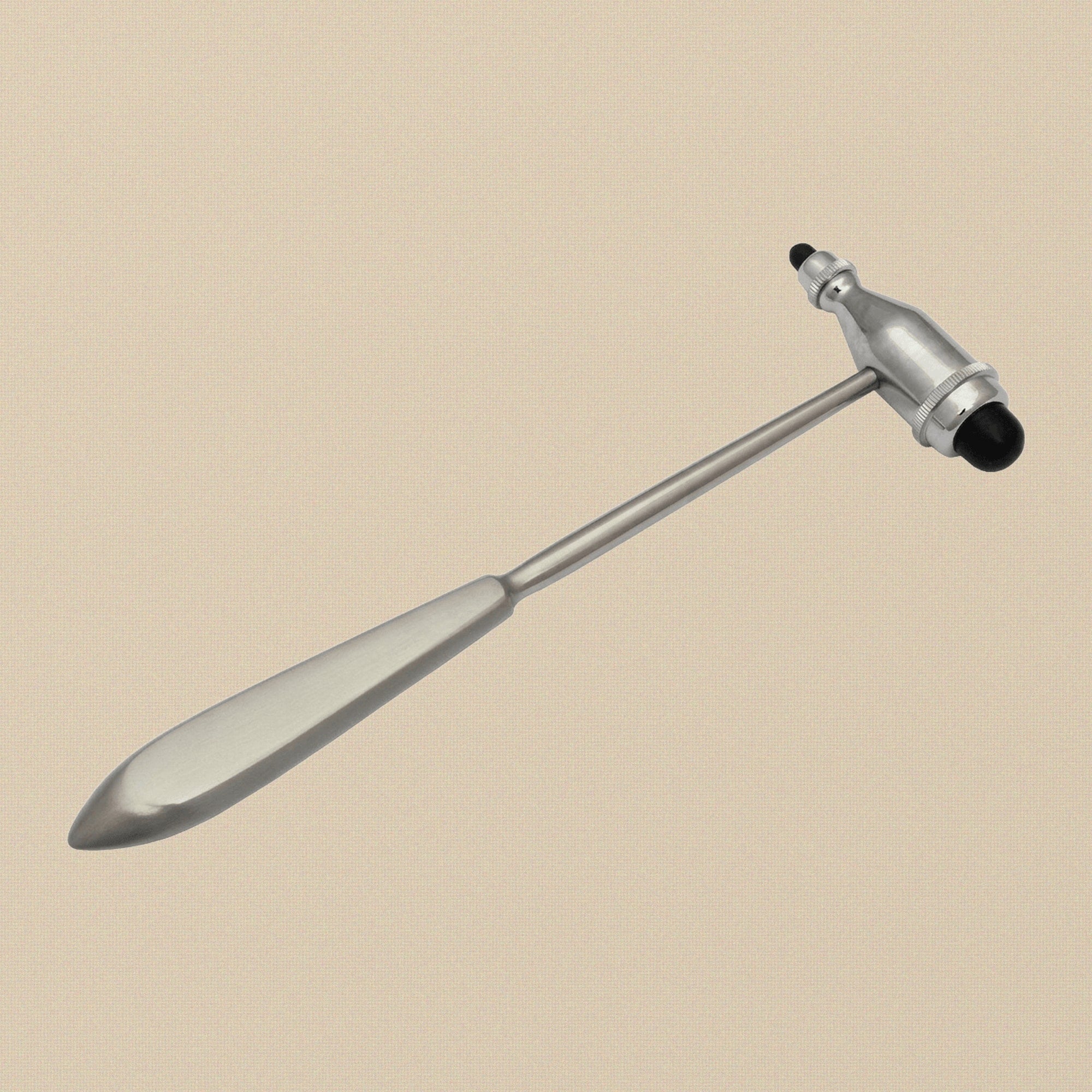 Close-up of the large and small synthetic rubber heads on the reflex hammer.