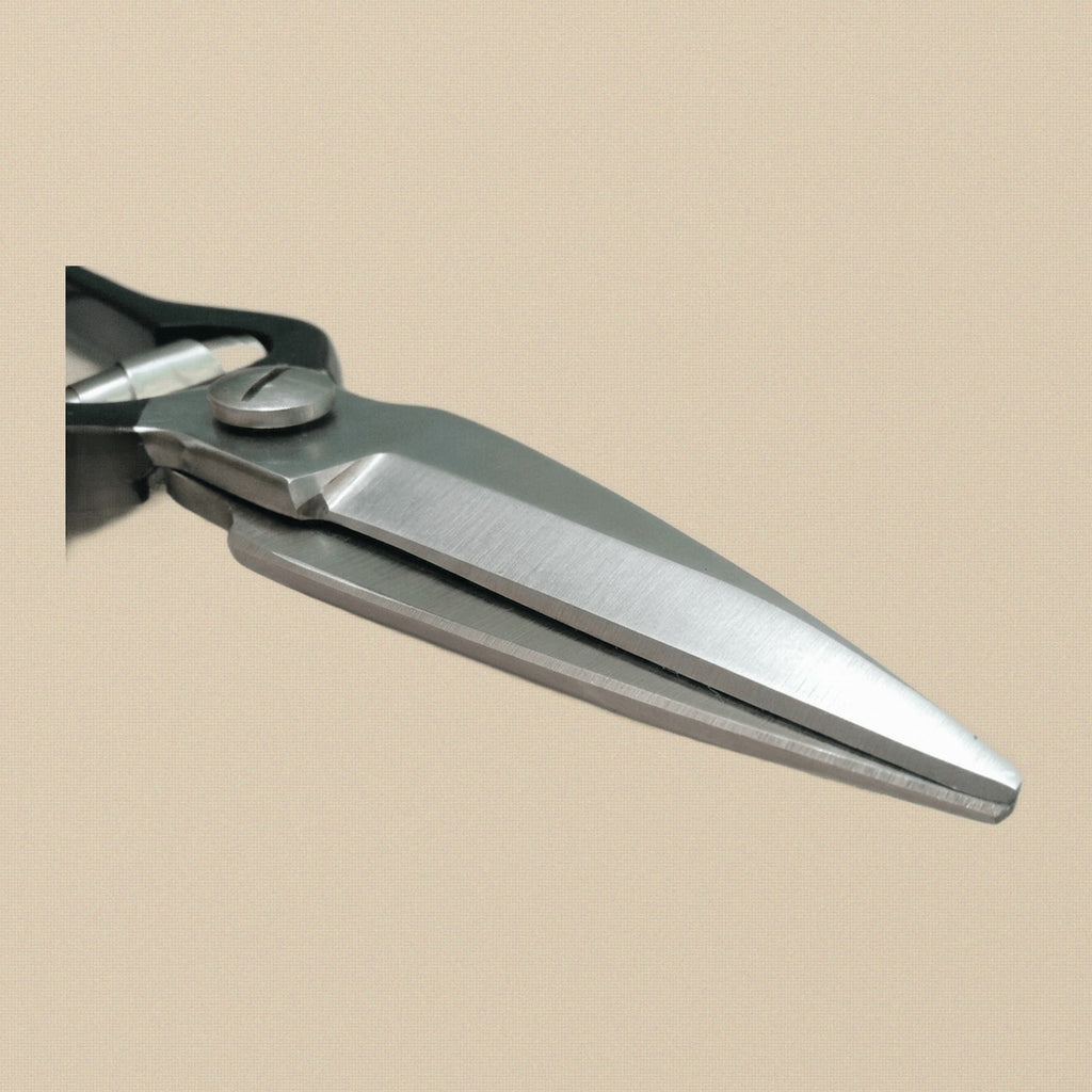 Close-up of the serrated and sharp blades on the stainless steel foot rot shears.