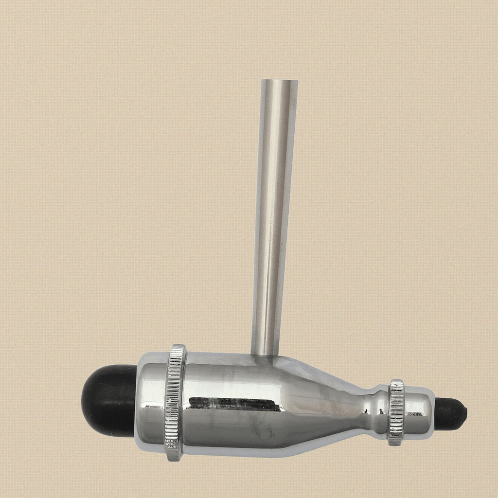 Detail of the pointed tip on the base of the stainless steel handle.