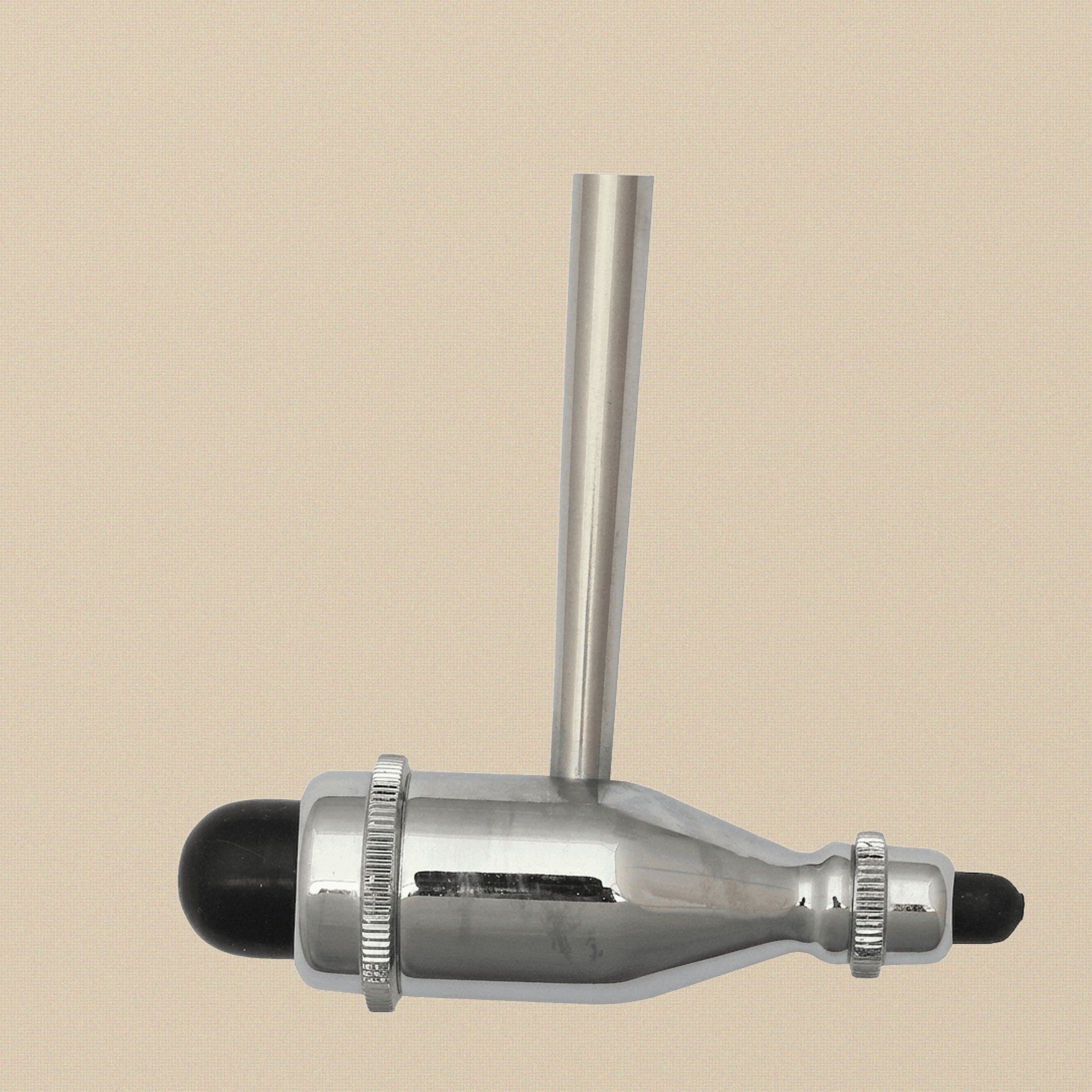 Detail of the pointed tip on the base of the stainless steel handle.