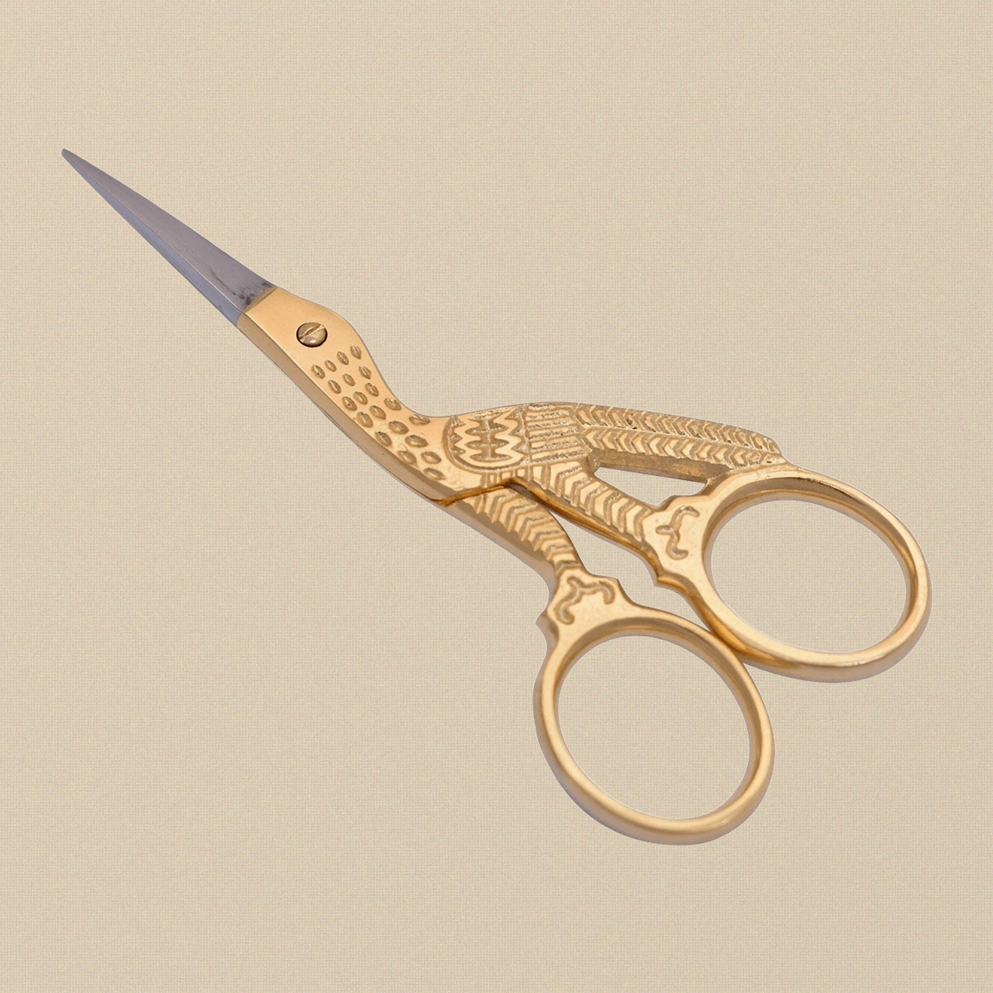 Gold-plated stork-shaped embroidery scissors, 3.5 inches long, shown closed on a white background.