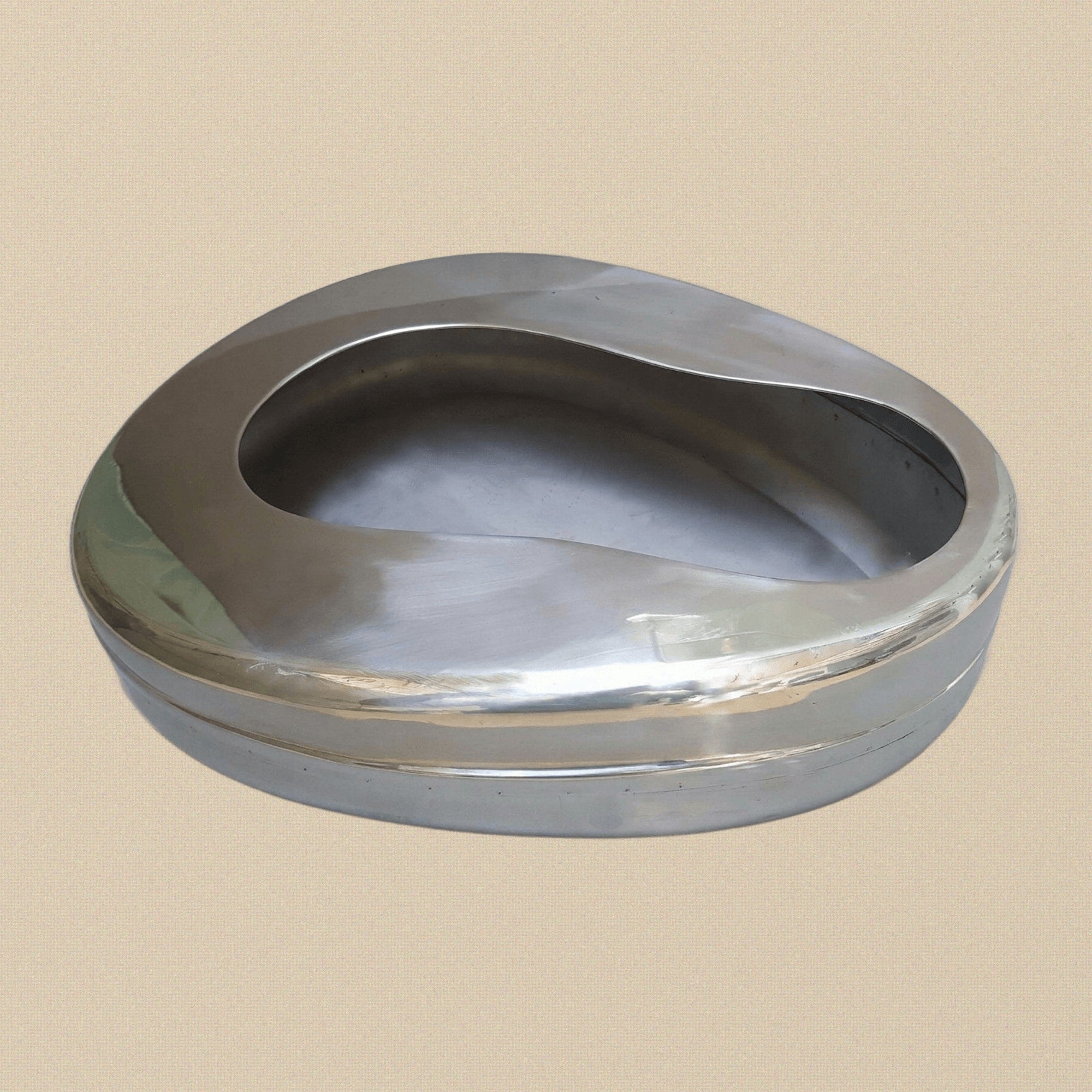Medical-grade stainless steel adult bedpan, top-down view showing the seamless interior.
