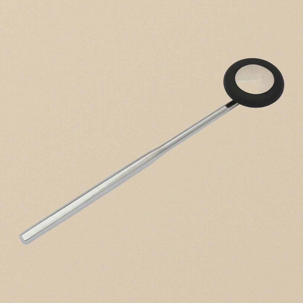 Close-up of the circular rubber head on the Babinski reflex hammer.