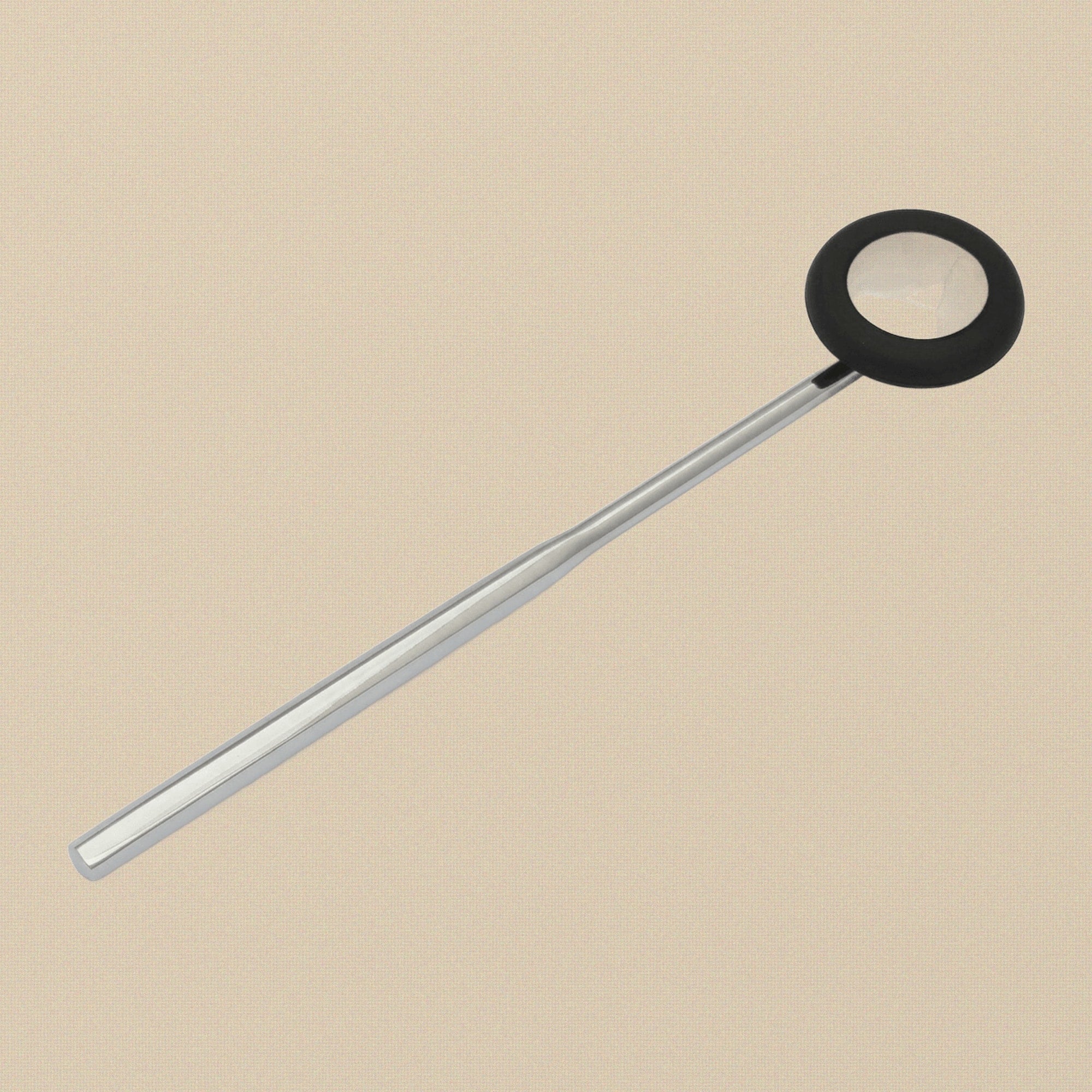 Close-up of the circular rubber head on the Babinski reflex hammer.