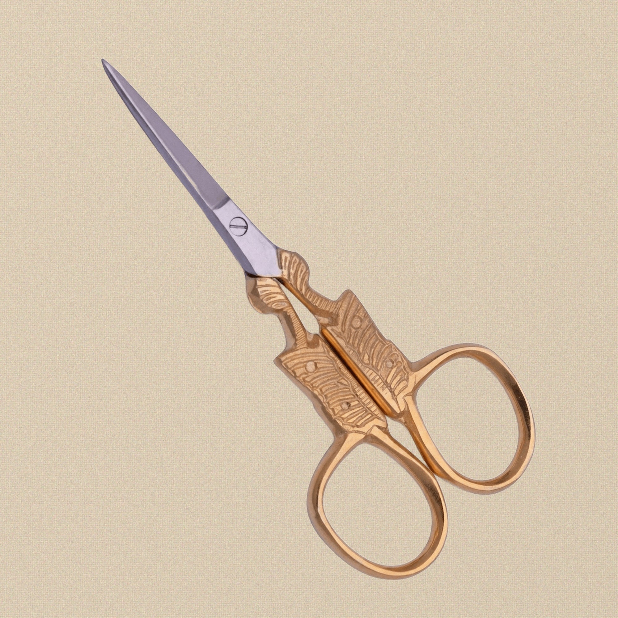 A pair of 89 mm gold-plated butterfly scissors, shown slightly open to display the blade detail.