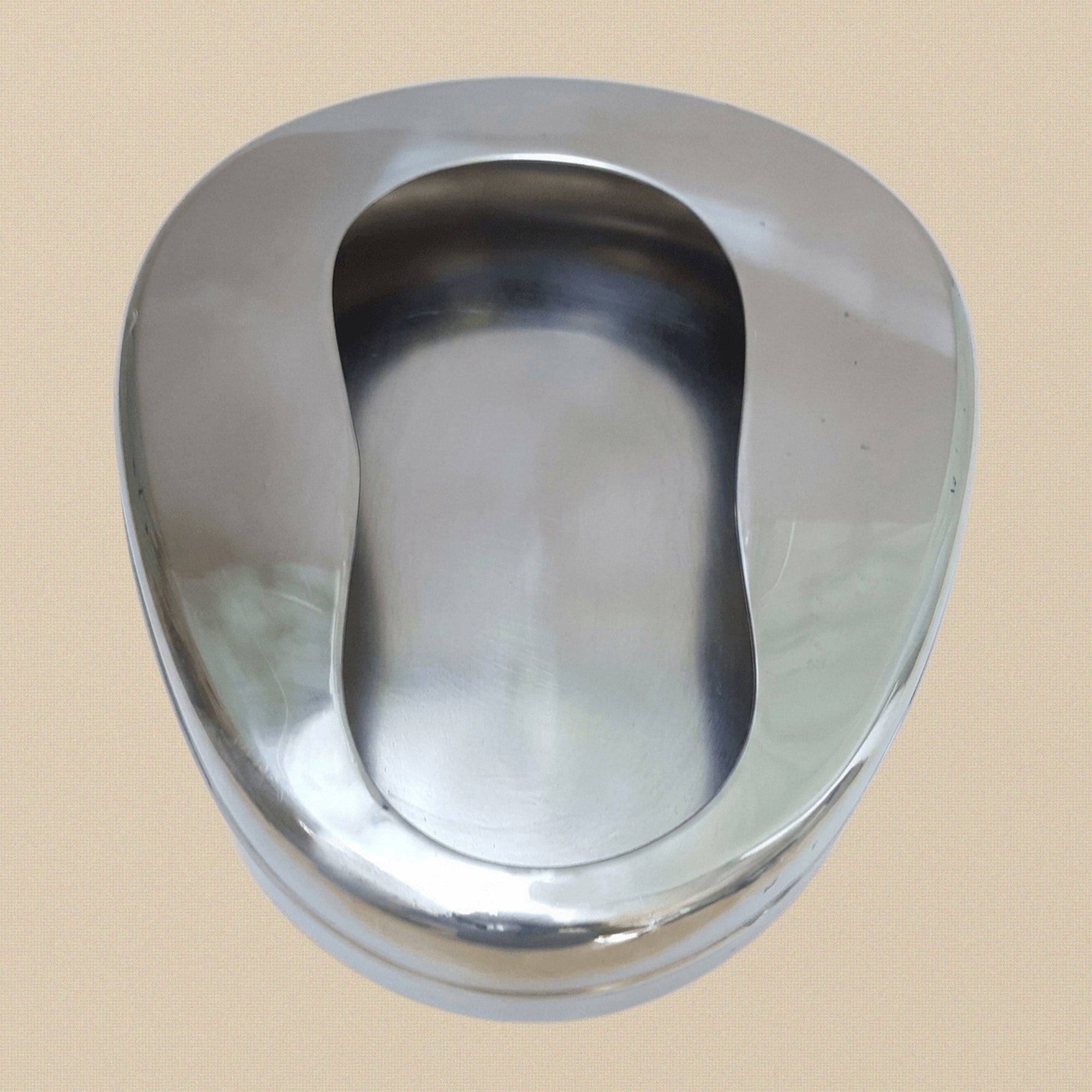 Side profile of the stainless steel bedpan, showing its 50 mm depth and contoured edge.