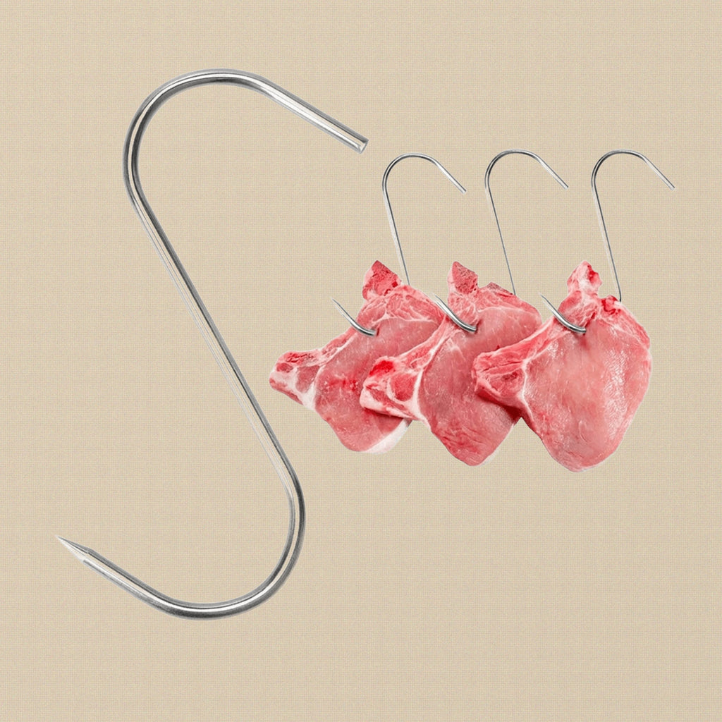 Multiple S-hooks hanging from a steel rail, demonstrating their use in a butchery setting.