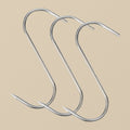 A single stainless steel S-shaped butcher's hook against a white background.