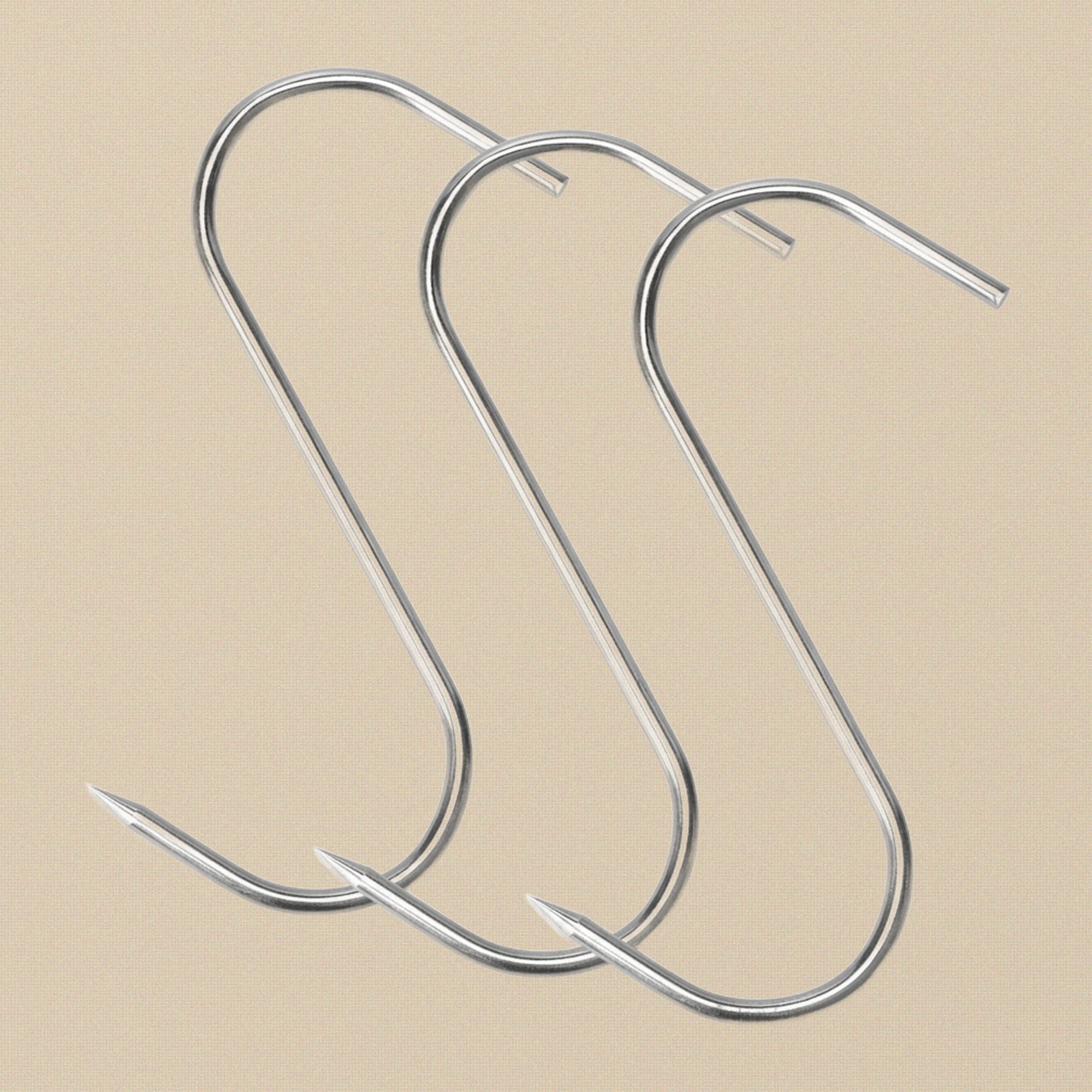 A single stainless steel S-shaped butcher's hook against a white background.